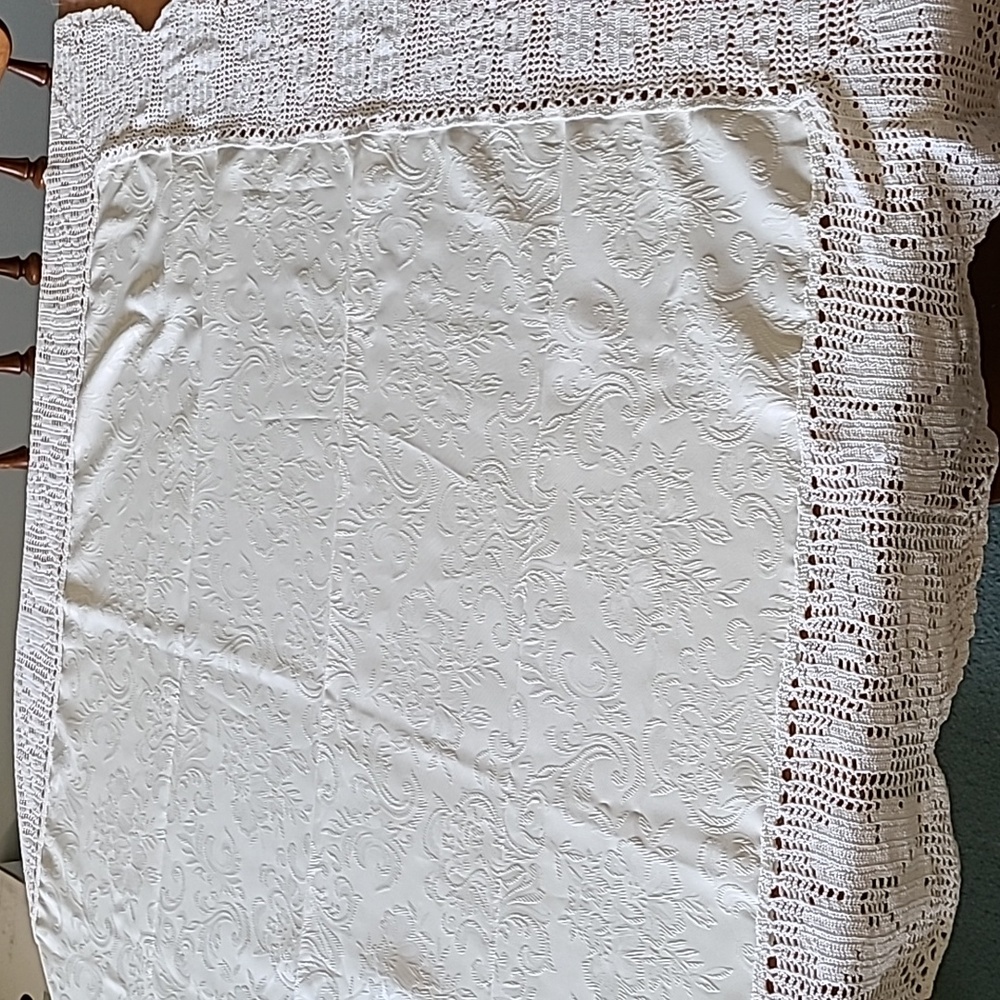 White table covering  with floral design